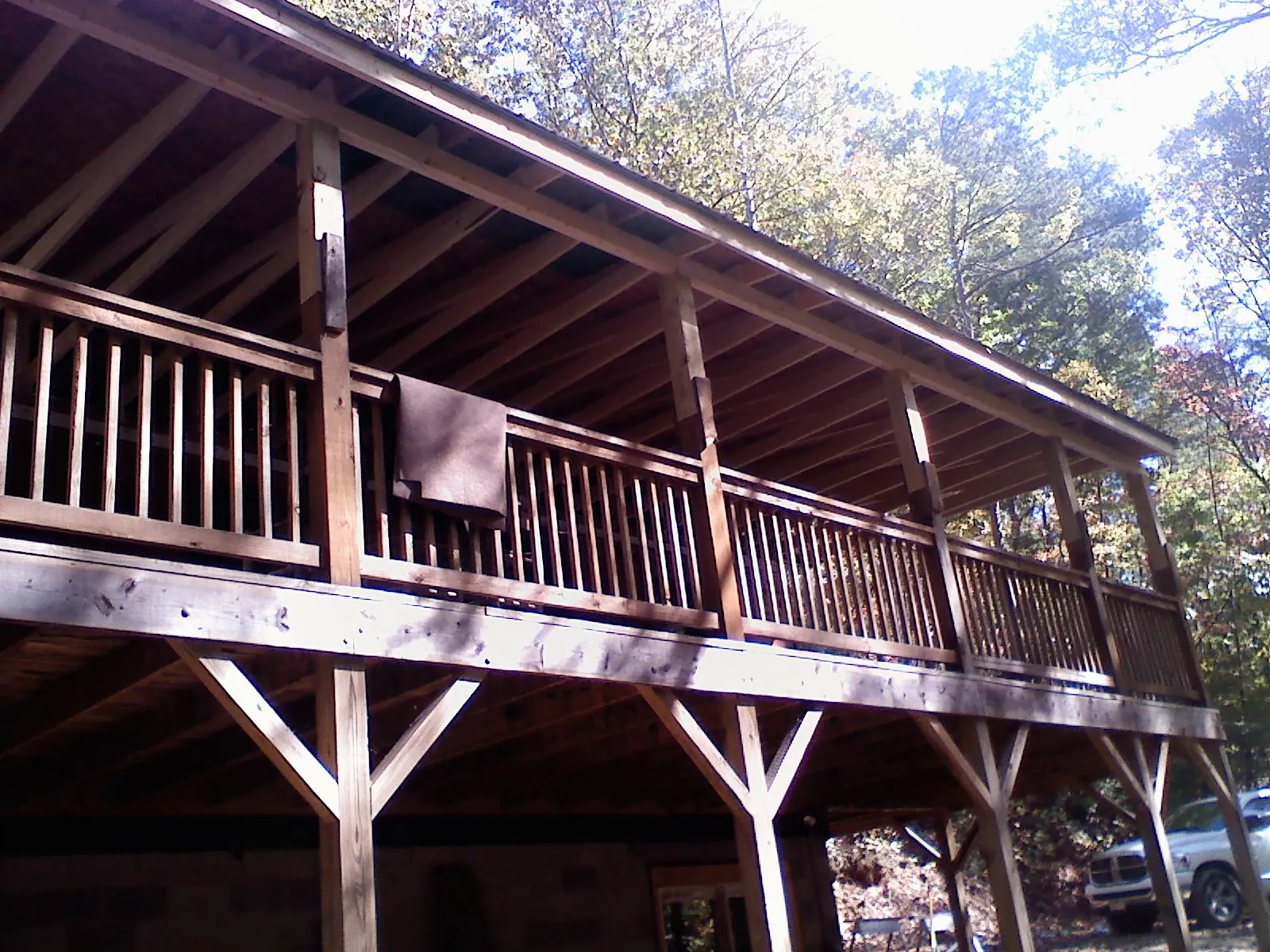 Timber framing under a new elevated porch and deck — Roof Leak Repair in Newfoundland by Roofing Brothers